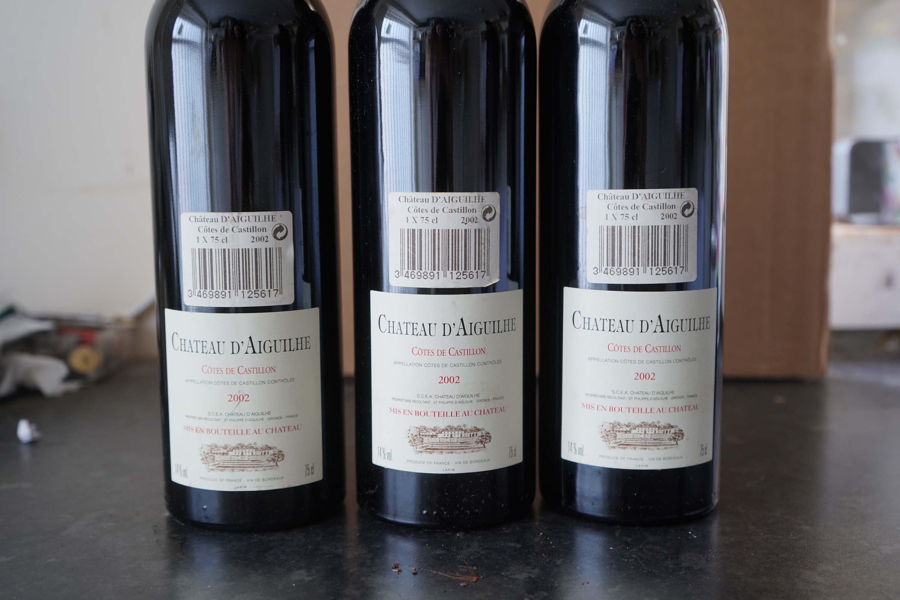Nine bottles of 2002 Chateau d'Aiguilhe Castillon Cotes de Bordeaux, France
